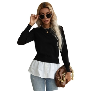 Women's two-piece style knit top featuring black long sleeves and white shirt hem