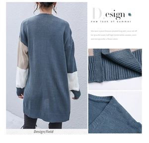 Detail view of women long knit cardigan featuring navy blue color block and ribbed textures