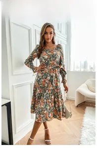 Close-up of floral print long sleeve dress with square neckline and ruffled tiered hemline