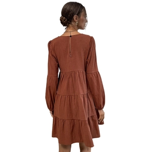 Brown long-sleeved tiered cotton linen dress with a crew neck and loose tiered skirt