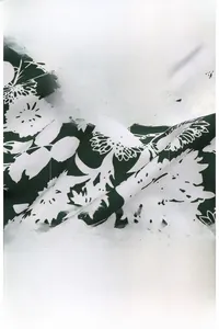 Detail of soft green floral fabric with dress size chart and garment specifications