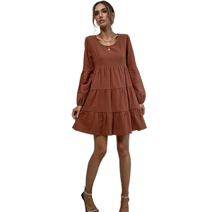 Caramel tiered long sleeve cotton linen maxi dress with round neck and pleated skirt