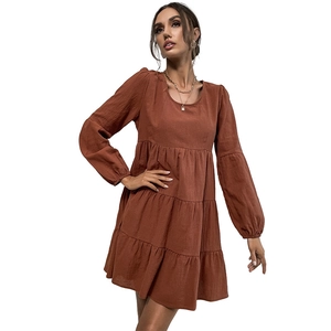 Brick red long-sleeve cotton linen dress with crew neck and layered ruffle skirt design