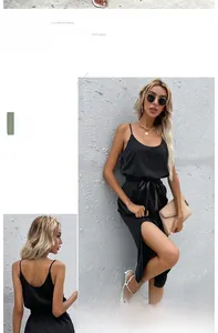 Close-up of a black sleeveless dress with drawstring waist and side slit details