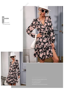 Detailed view of floral wrap dress with long sleeves and elegant pearl buckle belt