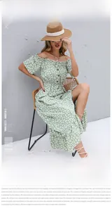 Detail of light green floral off-shoulder dress with wood buttons and ruffle sleeves