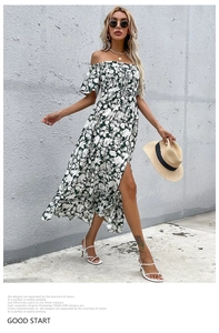 Detail of off-shoulder floral maxi dress with waist cinching and high side slit