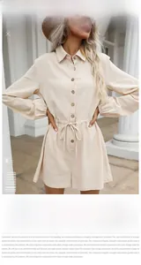 Detail of beige button-down romper featuring adjustable drawstring waist and lapel collar
