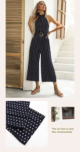 Detailed view of polka dot halter jumpsuit with neat stitching and fabric texture