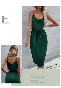 Detailed view of dark green satin midi dress with side slit and waist tie detail