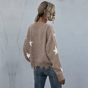 Women's V-neck light brown knit sweater with white stars and distressed tassel hem detail