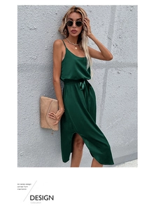 Detail of dark green satin midi dress featuring a side slit and waist tie design