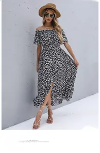 Detail of off-shoulder floral dress featuring ruffle neckline and irregular hemline