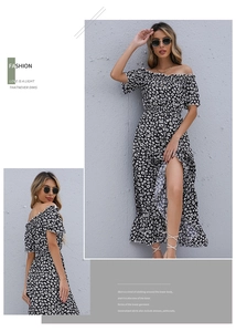 Detail of off-the-shoulder floral maxi dress with high slit and ruffle hem for summer