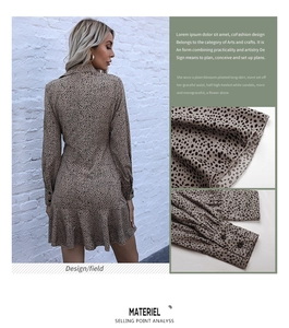 Detail shot of leopard print dress showing pleated ruffle hem and single button cuffs