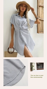 Dettaglio delle cuciture pulite e della lavorazione del vestito a camicia a righe blu