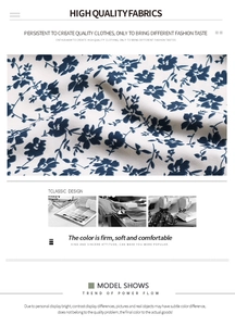 Macro detail of blue floral chiffon fabric showing print texture and sewing craftsmanship