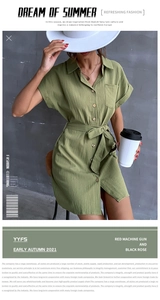 Detailed close-up of army green cotton linen shirt dress with wooden buttons and waist tie