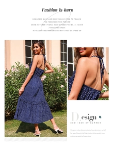 Detail of navy blue polka dot halter dress with backless design and light chiffon fabric