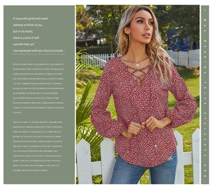 Detail of red and white leopard print blouse with V-neck lace-up and lantern sleeves