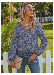 Detailed view of women's leopard print chiffon blouse with V-neck and lace-up neck design