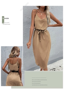 Detail of camel spaghetti strap dress with adjustable waist belt and elegant side slit