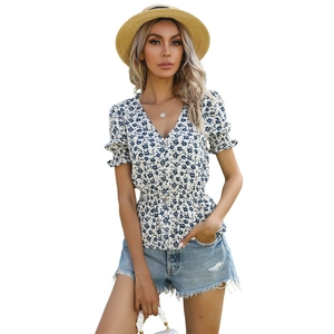 Summer floral V-neck chiffon top with blue prints and pleated waist on white background
