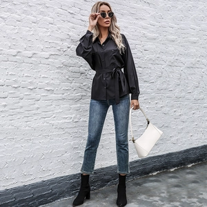 Elegant black long-sleeve button-up shirt with waist tie and front pockets for women
