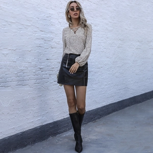 Women's leopard print V-neck chiffon blouse with black leather skirt and over-knee boots