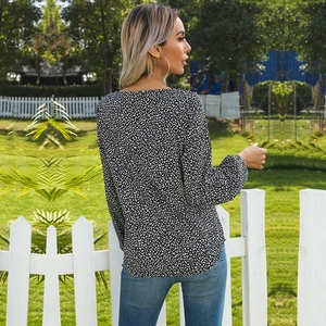 Women's leopard print chiffon blouse with V-neck and long sleeves on outdoor model