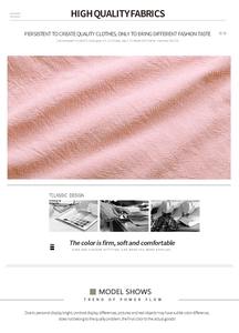 Detailed close-up of premium soft pink woven fabric texture and craftsmanship for dresses
