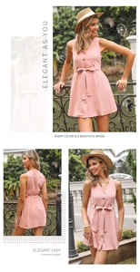 Detail view of pink V-neck sleeveless dress with wooden buttons and waist tie