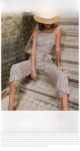Close-up detail of leopard print jumpsuits with belted waist and wide leg flowy fit