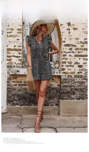 Detail view of the summer leopard print romper with ruffled cap sleeves and waist tie