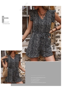 Detail of leopard print romper featuring ruffled cap sleeves and adjustable waist tie belt