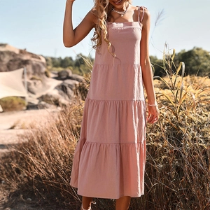 Pink cotton linen tiered midi dress with spaghetti straps and layered ruffled skirt