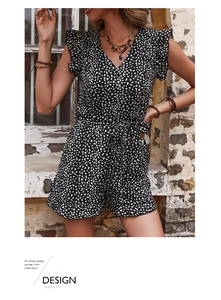 Detail of V-neckline and ruffled flutter sleeves on leopard print summer romper
