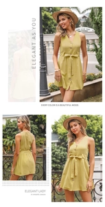 Detail of mustard yellow V-neck sleeveless dress with button front and waist tie