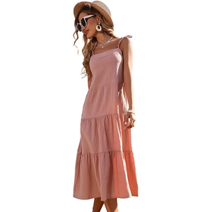 Pink cotton linen tiered midi dress with tie straps for summer beach vacation