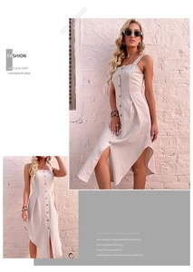 Detail of beige cotton linen dress with square neck, buttons, and asymmetrical hem