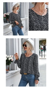 Close-up of lightweight chiffon fabric featuring stylish white polka dots on a black blouse