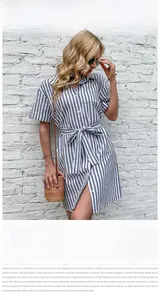 Detail view of the classic lapel and matching tie-waist on a blue striped shirt dress