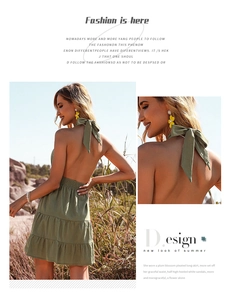 Detail shot of green cotton linen mini dress with backless halter tie and elastic waist