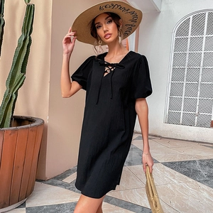 Chic black cotton linen dress with V-neck tie and puff sleeves for a summer vacation look