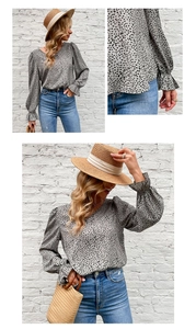 Detail of grey puff sleeve V-neck top with black polka dots and ruffled elastic cuffs