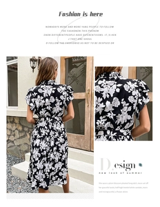 Detailed back view and ruffle sleeve design of the black floral pleated maxi dress