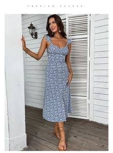 Detailed view of dark blue floral midi dress with ruffled sleeves and V-neck design