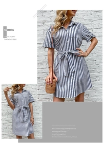 Detail of blue and white striped shirt dress featuring a waist tie and collared neckline