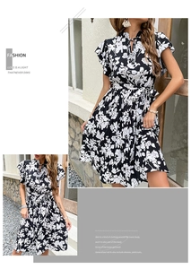 Detail of floral printed dress with ruffle sleeves and matching waist belt