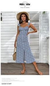 Detail of blue floral sundress featuring ruffle straps, sweetheart neck and side slit